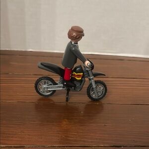 Playmobile man on dirt bike